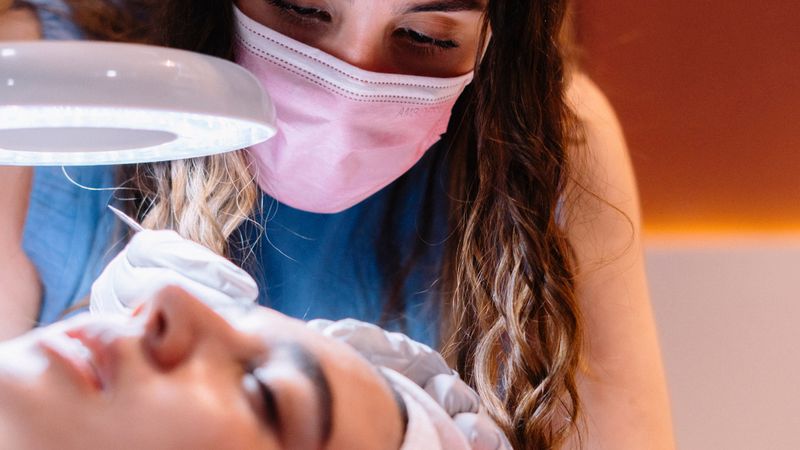 A facial treatment in a warmly lit treatment room