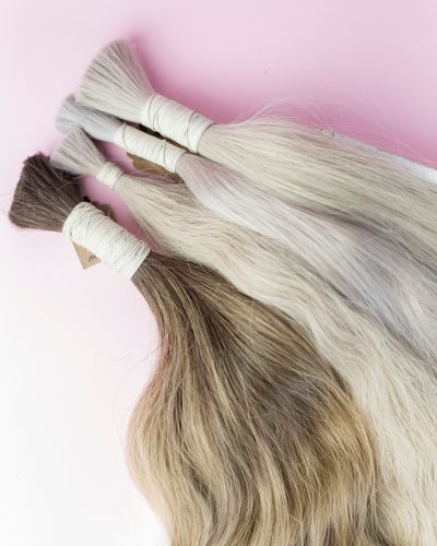 Hair being colour-matched for an extension fitting