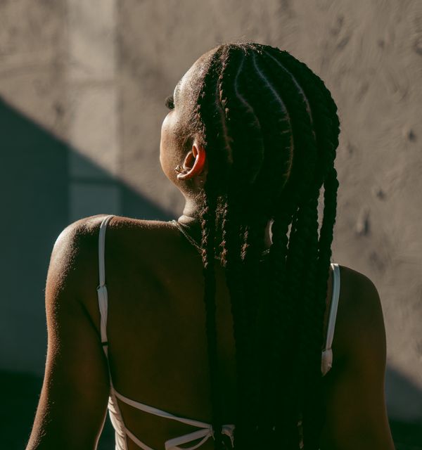Cornrows worked close to the scalp, detail of the parting pattern