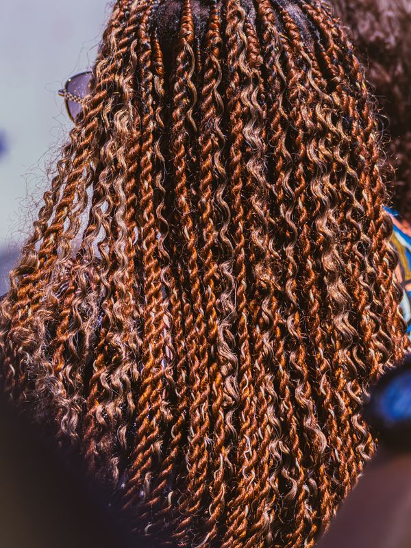 A finished box-braid parting, close up