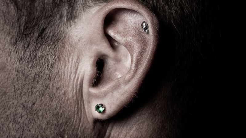 Close-up of a healed cartilage piercing with jewellery