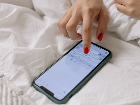 A woman's hand holding a phone